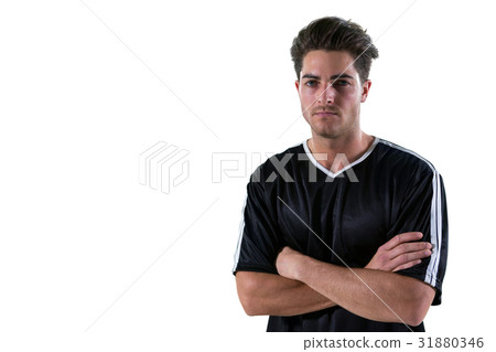 Portrait of football player standing with arms crossed 31880346