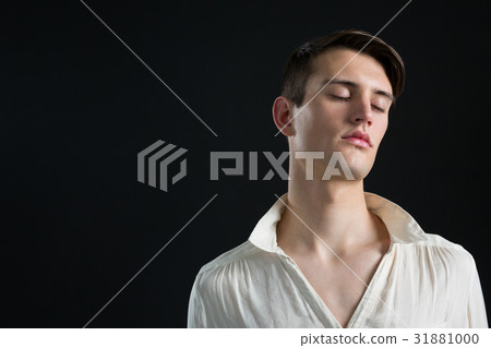 Androgynous man posing with his eyes closed Androgynous man posing with his eyes closed 31881000