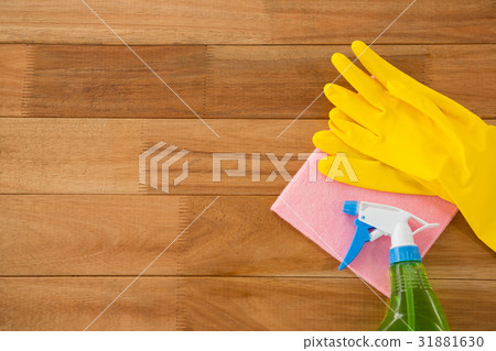 Overhead view of gloves with wipe pad and chemical bottle 31881630