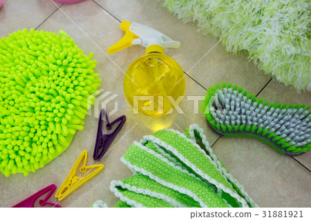 Overhead view of sponges and cleaning products on floor 31881921