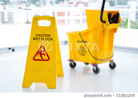 Sigh board with mop bucket in room 31882209
