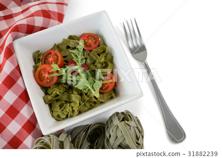 Close up of pasta in bowl by napkin 31882239