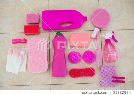 Overhead view of pink color cleaning equipment on floor 31882984