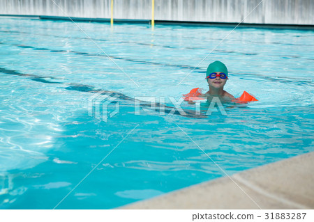 Boy swimming in the pool Boy swimming in the pool 31883287