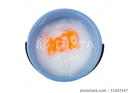 High angle view of sponge in bucket containing soap sud 31883347
