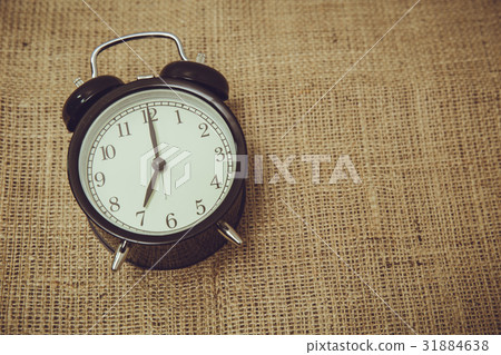 retro old back bell clock time at 7 o'clock retro old back bell clock time at 7 o'clock 31884638