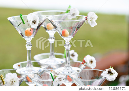 Champagne tower ready to spill alcohol Champagne tower ready to spill alcohol 31886371