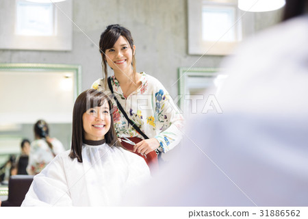 Young female hairdresser and female customer Young female hairdresser and female customer 31886562