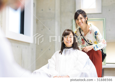 Young female hairdresser and female customer 31886566