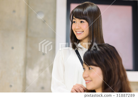 Young female hairdresser and female customer Young female hairdresser and female customer 31887289