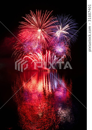 Firework.Beautiful colorful fireworks on the water 31887401