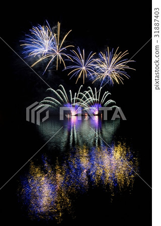 Firework.Beautiful colorful fireworks on the water Firework.Beautiful colorful fireworks on the water 31887403