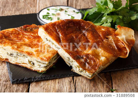 Homemade sliced burek stuffed with spinach 31889508