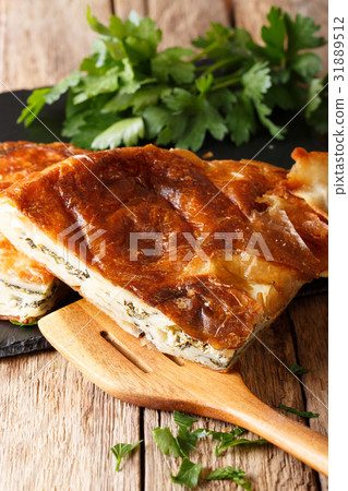 Freshly baked burek stuffed with spinach Freshly baked burek stuffed with spinach 31889512