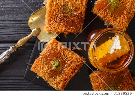 Turkish dessert kunefe with pistachio powder Turkish dessert kunefe with pistachio powder 31889529