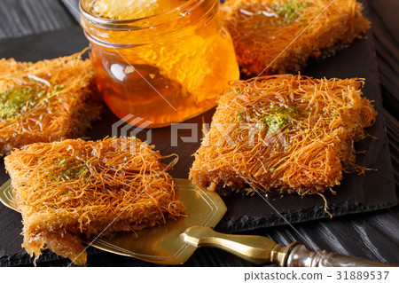 Turkish dessert kunefe with pistachio powder Turkish dessert kunefe with pistachio powder 31889537