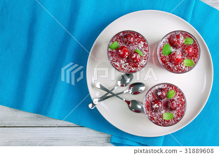 cherry jelly in three glass cups 31889608