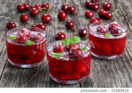 sweet cherry jelly in three glass cups sweet cherry jelly in three glass cups 31889616
