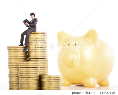 young man counting coin in poggy bank 31890556
