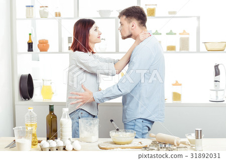 Funny Couple in love cooking dough and having fun Funny Couple in love cooking dough and having fun 31892031
