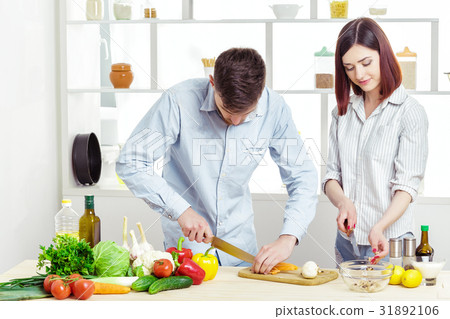Loving happy couple preparing healthy salad of Loving happy couple preparing healthy salad of 31892106