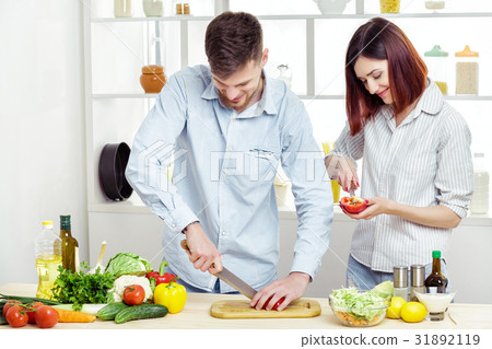 Loving smiling couple preparing healthy salad of Loving smiling couple preparing healthy salad of 31892119
