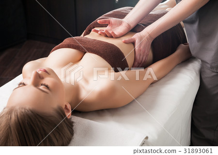 Woman enjoying Ayurveda oil massage in spa Woman enjoying Ayurveda oil massage in spa 31893061