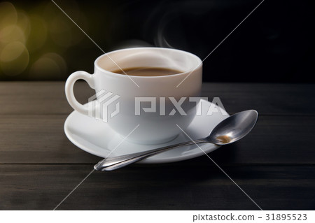 White coffee cup with smoke on black background 31895523