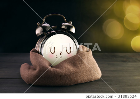 Alarm clock and brown mug with a happy smile 31895524