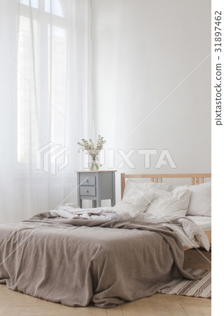 View of an unmade crumpled bed View of an unmade crumpled bed 31897462