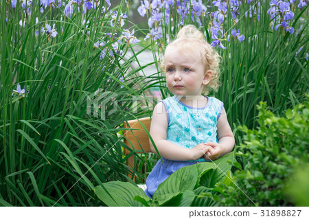 Little girl in the garden. Little girl in the garden. 31898827