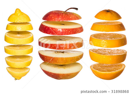 Creative concept with Flying fruits. Sliced orange, lemon, apple isolated on white.  31898868