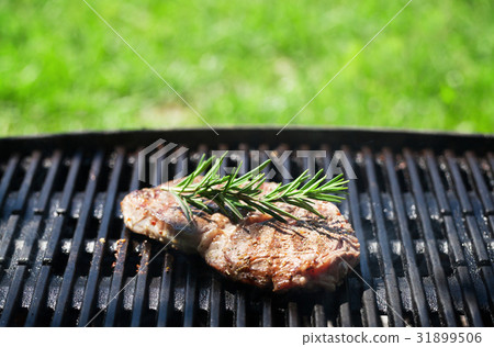 Grilled beef steak with rosemary Grilled beef steak with rosemary 31899506