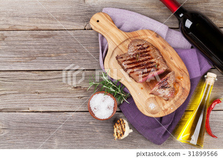 Grilled beef steak and wine 31899566
