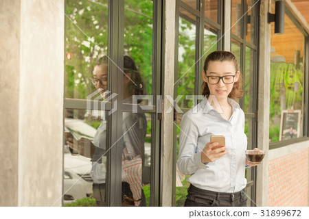 Freelance casual business woman use phone Freelance casual business woman use phone 31899672