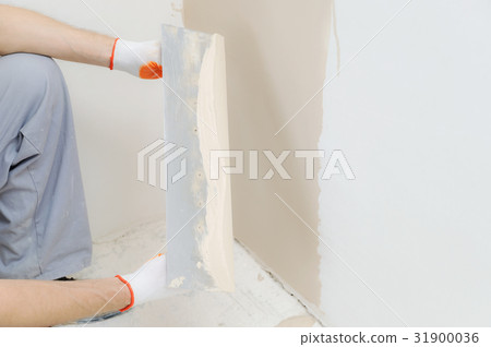 Worker's hands are plastering. Worker's hands are plastering. 31900036