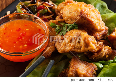 Fried chicken pieces in batter 31900309