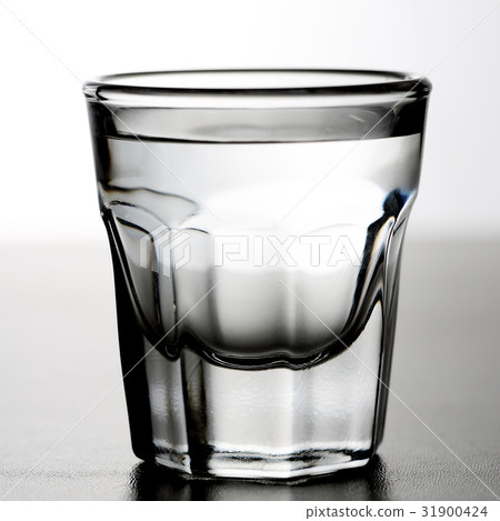 Shot glass of alcoholic drink as tequila or vodka Shot glass of alcoholic drink as tequila or vodka 31900424