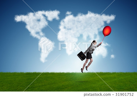 Businesswoman flying balloons on bright day 31901752