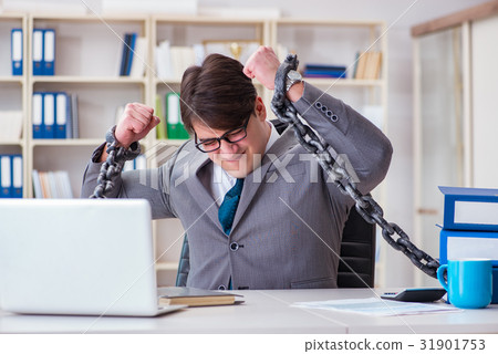 Businessman tied with chains to his work 31901753