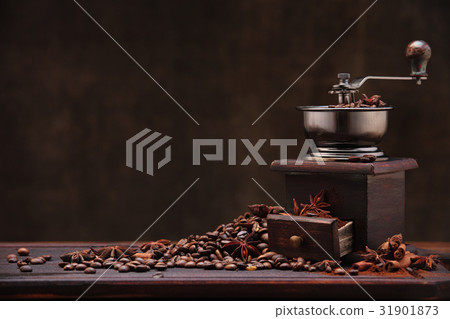 Coffee beans and grinder. 31901873