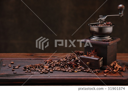 Coffee beans and grinder. 31901874
