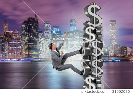 Businessman climbing dollar challenge tower 31902020