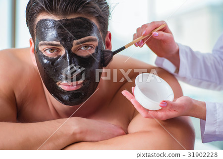 Handsome man in spa massage concept Handsome man in spa massage concept 31902228