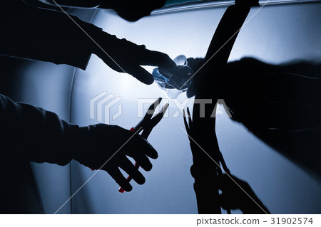 Car thief using a tool to break into a car 31902574
