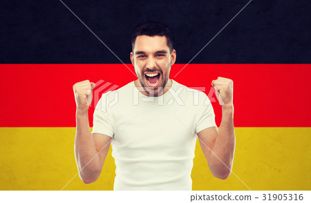 angry man showing fists over german flag 31905316