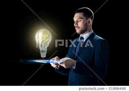 businessman with tablet pc and lightbulb 31906490
