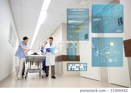 medics and patient on hospital gurney at emergency 31906492