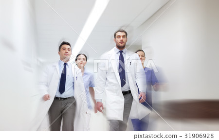 group of medics walking along hospital 31906928