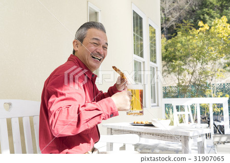 A senior male with a glass with beer A senior male with a glass with beer 31907065